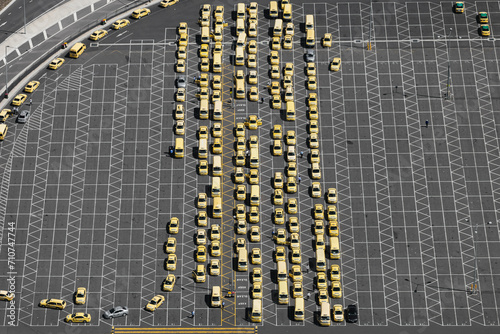 Aerial perspective of taxis lined up in airport car park, showcasing organized transportation services, Australia. photo
