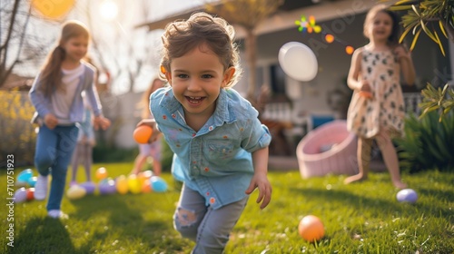 Children participating in an Easter egg roll on a sunlit lawn, the colorful eggs gliding across the grass as the HD camera captures the competitive yet fun-filled moments photo
