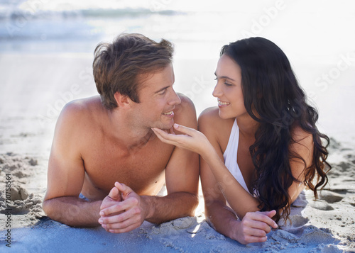 Love, smile and relax with couple on beach together for summer vacation, holiday or romance on sand. Travel, island or tropical with happy young man and woman on coast by sea or ocean for bonding