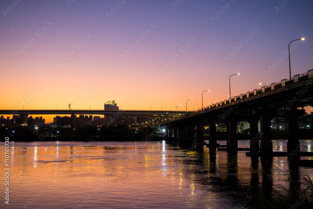 Bridge cross the river in Taipei city at sunset