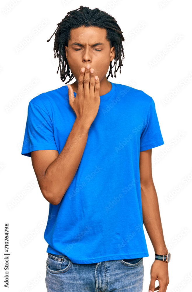 Young african american man wearing casual clothes bored yawning tired covering mouth with hand. restless and sleepiness. Young african american man wearing casual clothes bored yawning tired covering mouth with hand. restless and sleepiness.