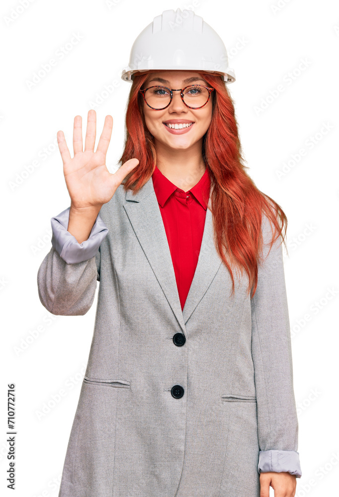 Young redhead woman wearing architect hardhat showing and pointing up with fingers number five while smiling confident and happy. Young redhead woman wearing architect hardhat showing and pointing up with fingers number five while smiling confident and happy.