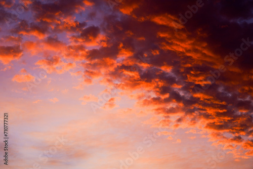 Vivid clouds illuminated by the sunset in a gradient sky