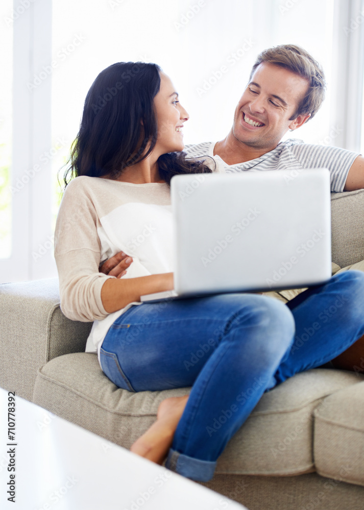 Couple, laptop and relax together on sofa with love, living room and wellness in marriage for bonding. Woman, man and smile for relationship care on subscription, weekend and streaming video in home