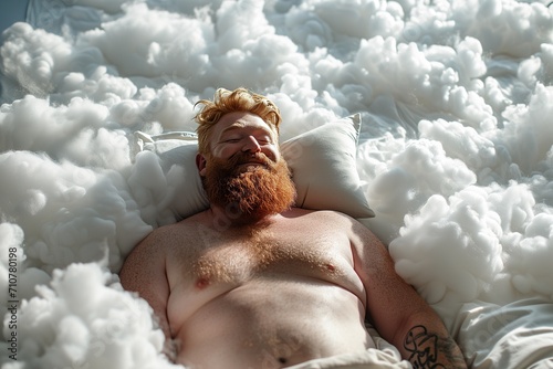 Chubby bodybuilder and ginger beard with a smile sleep on a bed with a soft white dazzling blanket
