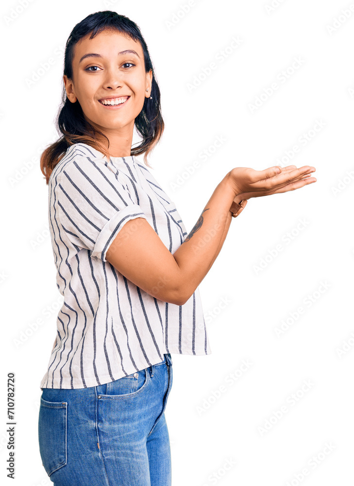 Young woman wearing casual clothes pointing aside with hands open palms showing copy space, presenting advertisement smiling excited happy Young woman wearing casual clothes pointing aside with hands open palms showing copy space, presenting advertisement smiling excited happy