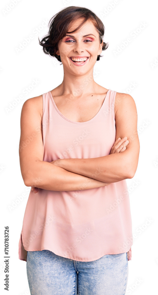 Beautiful young woman with short hair wearing casual style with sleeveless shirt happy face smiling with crossed arms looking at the camera. positive person.