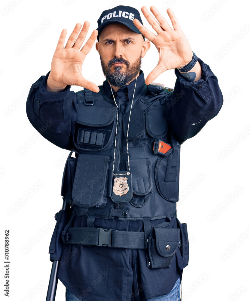Young handsome man wearing police uniform doing frame using hands palms and fingers, camera perspective Young handsome man wearing police uniform doing frame using hands palms and fingers, camera perspective