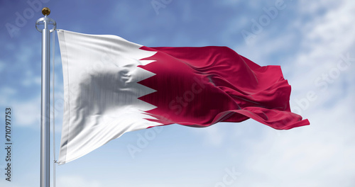Qatar national flag waving in the wind on a clear day