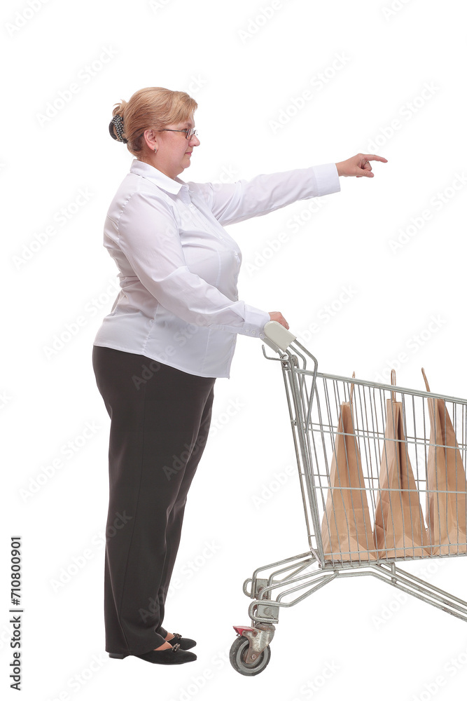 Full length portrait of a woman pushing a shopping trolley Full length portrait of a woman pushing a shopping trolley