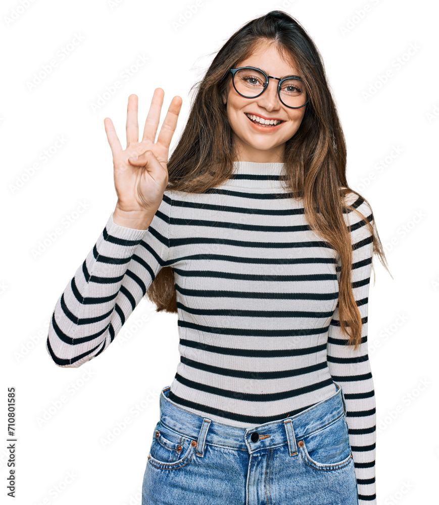 Young beautiful teen girl wearing casual clothes and glasses showing and pointing up with fingers number four while smiling confident and happy. Young beautiful teen girl wearing casual clothes and glasses showing and pointing up with fingers number four while smiling confident and happy.