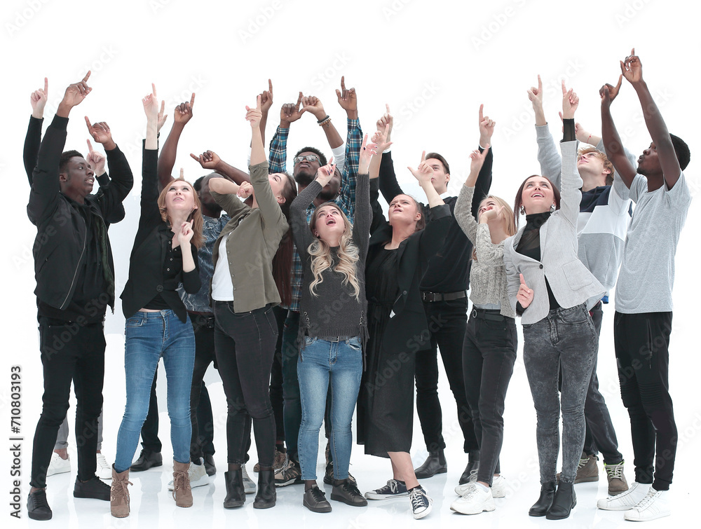 Casual group of excited friends with arms up isolated on white