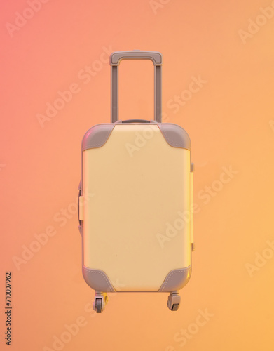 Beautiful brightly colored suitcase for vacation. Vacation idea.