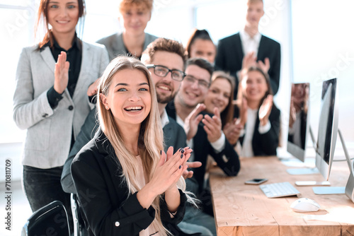 happy group of young professionals applauding their success.