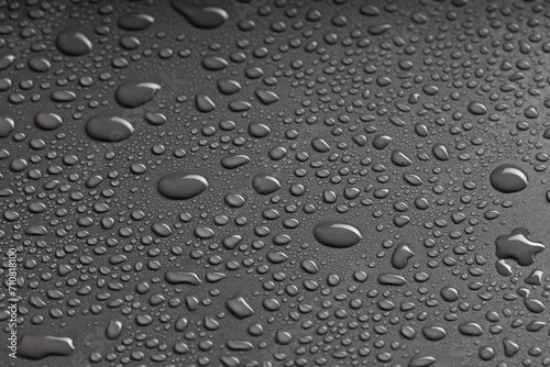 Wallpaper Mural top view of a black surface with water droplets of various shapes Torontodigital.ca