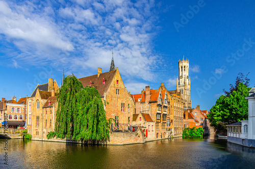 Brugge old town scenic view, Bruges historic city centre, Rosary Quay Rozenhoedkaai embankment with buildings, Belfort Belfry tower, Dijver water canal of Reie river, West Flanders province, Belgium