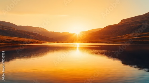 Sunset on the lake in the mountains. Landscape with lake and mountains.