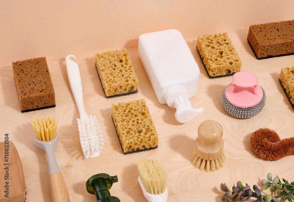 Pattern of sponges, brushes and detergent dispenser. Washing dishes.