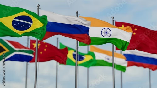 BRICS flags waving together on cloudy sky, endless seamless loop photo