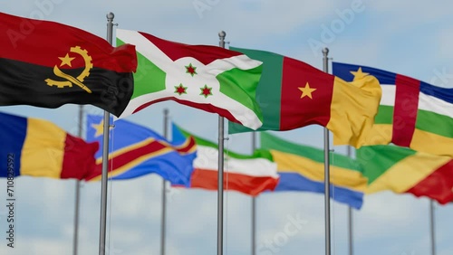 Economic Community of Central African States or ECCAS flags waving together on cloudy sky, endless seamless loop photo