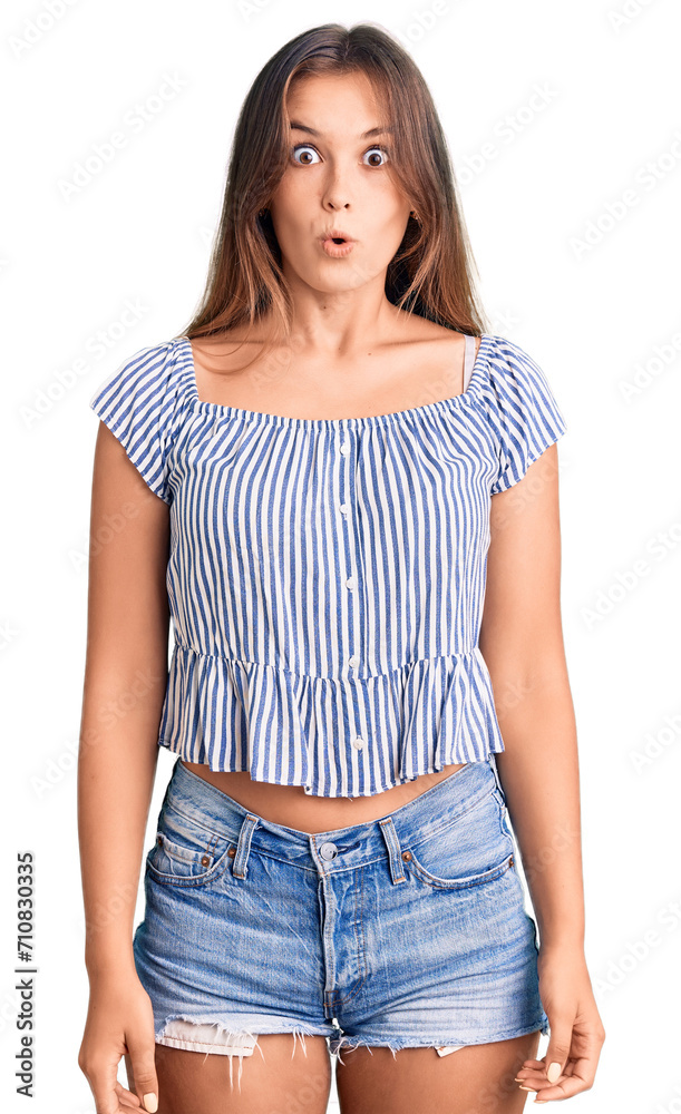 Beautiful caucasian woman wearing casual clothes scared and amazed with open mouth for surprise, disbelief face Beautiful caucasian woman wearing casual clothes scared and amazed with open mouth for surprise, disbelief face