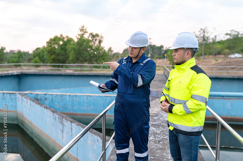 Environmental engineers work at wastewater treatment plants,Water supply engineering working at Water recycling plant for reuse,Technicians and engineers discuss work together. Environmental engineers work at wastewater treatment plants,Water supply engineering working at Water recycling plant for reuse,Technicians and engineers discuss work together.