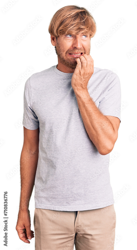 Handsome caucasian man with beard wearing casual tshirt looking stressed and nervous with hands on mouth biting nails. anxiety problem. Handsome caucasian man with beard wearing casual tshirt looking stressed and nervous with hands on mouth biting nails. anxiety problem.
