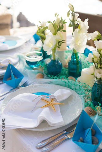 decorated table in the restaurant for a wedding dinner