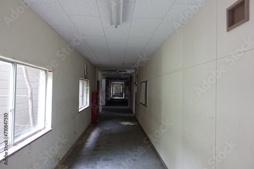 abandoned school building crumbling away with interior still inside