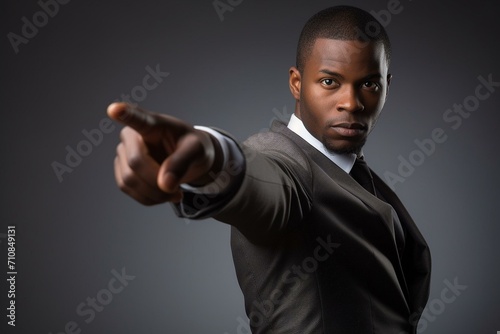 Confident Businessman Pointing Forward