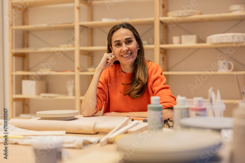 mature woman portrait in a ceramics and crafts workshop