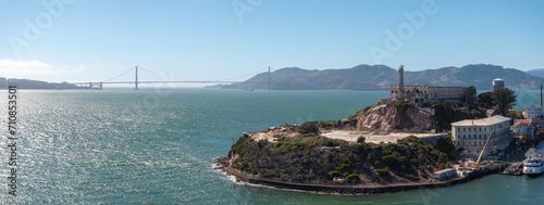 Aerial view of the prison island of Alcatraz in San Francisco Bay, Alcatraz jail in San Francisco bay aerial view. Beautiful aerial view of the Alcatraz island with Golden Gate bridge.
