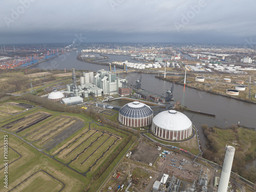 Fossil fuels, coal fired power plant in the port of Hamburg, Germany. Birds eye aerial drone view.