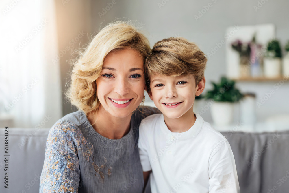 Affectionate moment between smiling mother and son at home, showcasing a warm, loving family dynamic Affectionate moment between smiling mother and son at home, showcasing a warm, loving family dynamic
