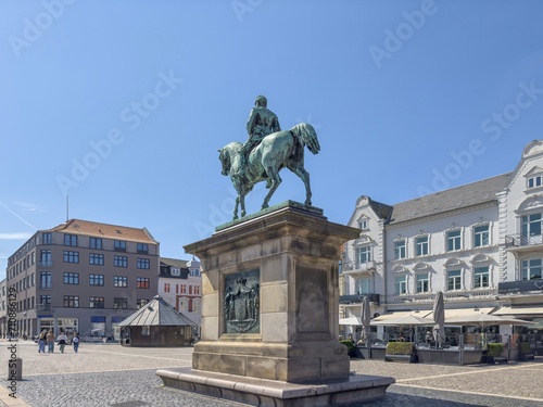 Square with statue - Happy walkers through the streets of Esbjerg, Denmark