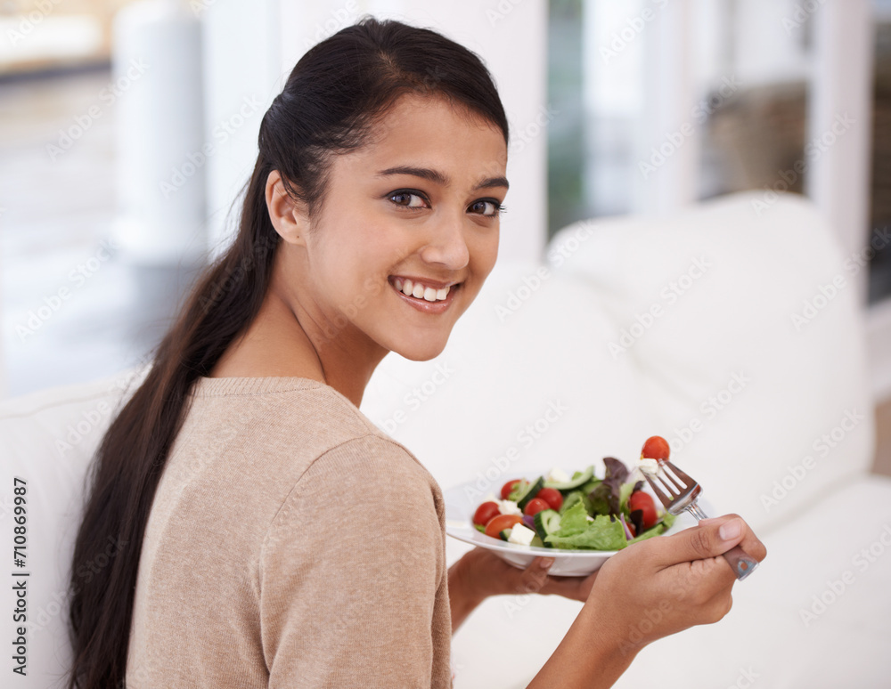Happy woman, portrait and salad bowl for diet, nutrition or healthy snack sitting on sofa at home. Face of female person smile in relax with mixed vegetables, vitamin or meal for weight loss at house Happy woman, portrait and salad bowl for diet, nutrition or healthy snack sitting on sofa at home. Face of female person smile in relax with mixed vegetables, vitamin or meal for weight loss at house