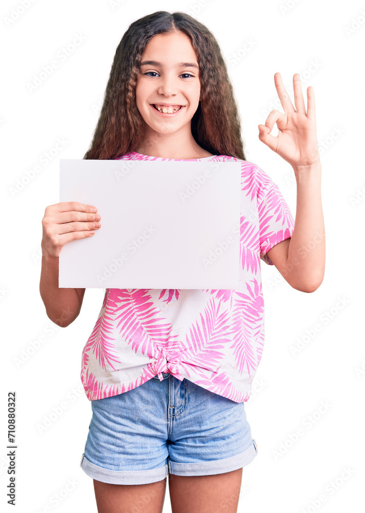 Cute hispanic child girl holding blank empty banner doing ok sign with fingers, smiling friendly gesturing excellent symbol Cute hispanic child girl holding blank empty banner doing ok sign with fingers, smiling friendly gesturing excellent symbol