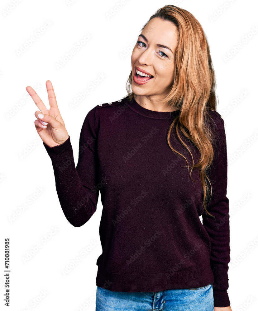 Young caucasian woman wearing casual clothes showing and pointing up with fingers number two while smiling confident and happy. Young caucasian woman wearing casual clothes showing and pointing up with fingers number two while smiling confident and happy.