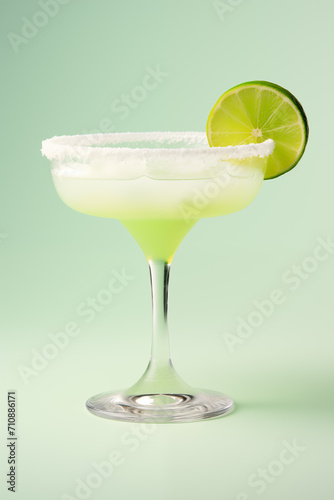 a glass with a drink and a slice of lime