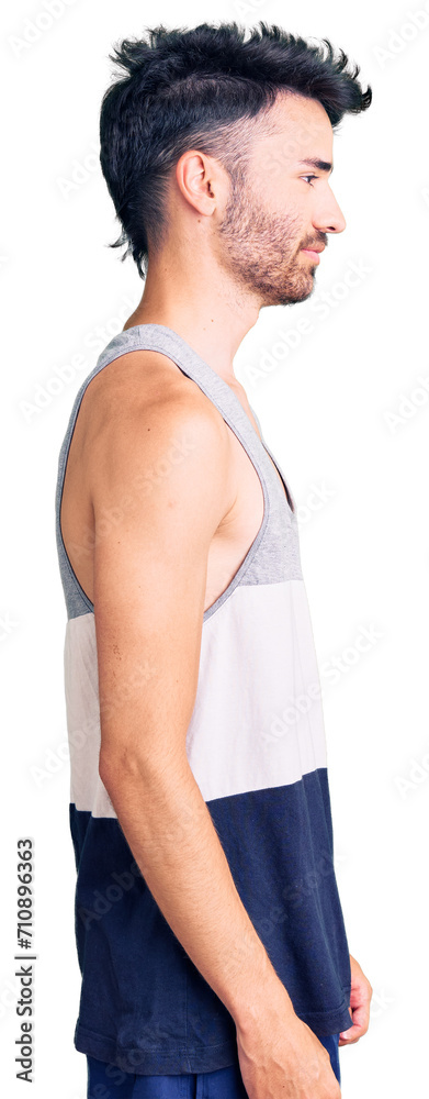 Young hispanic man wearing casual clothes looking to side, relax profile pose with natural face with confident smile. Young hispanic man wearing casual clothes looking to side, relax profile pose with natural face with confident smile.