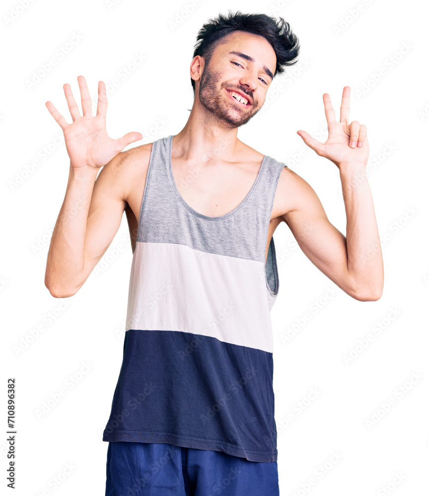 Young hispanic man wearing casual clothes showing and pointing up with fingers number eight while smiling confident and happy. Young hispanic man wearing casual clothes showing and pointing up with fingers number eight while smiling confident and happy.