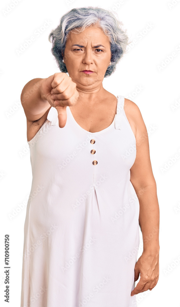 Senior woman with gray hair wearing casual clothes looking unhappy and angry showing rejection and negative with thumbs down gesture. bad expression. Senior woman with gray hair wearing casual clothes looking unhappy and angry showing rejection and negative with thumbs down gesture. bad expression.
