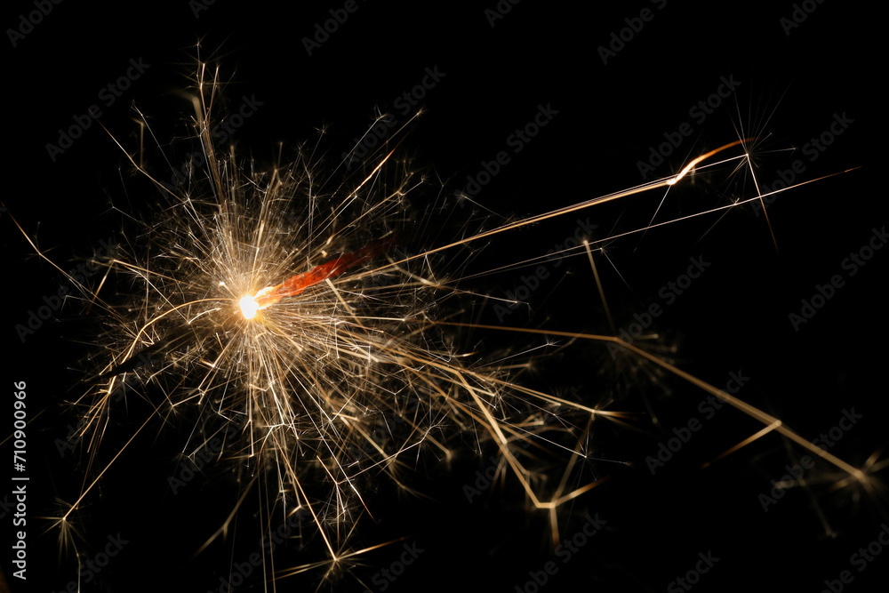 Burning sparkler. Abstraction. Festive background.