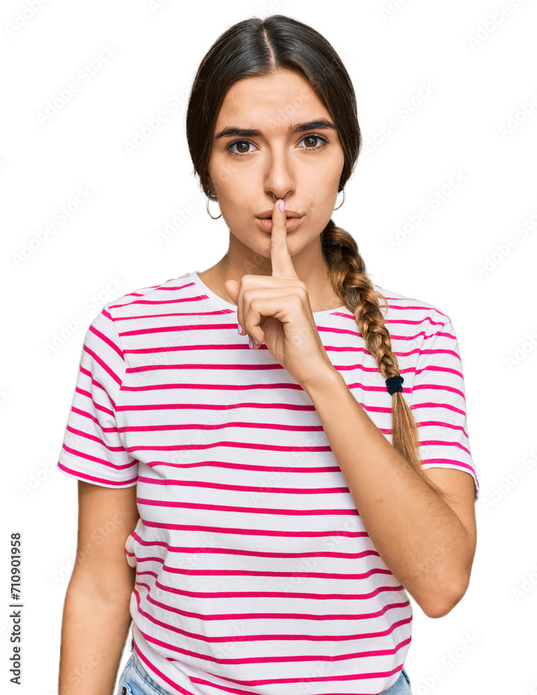 Young hispanic woman wearing casual clothes asking to be quiet with finger on lips. silence and secret concept. Young hispanic woman wearing casual clothes asking to be quiet with finger on lips. silence and secret concept.