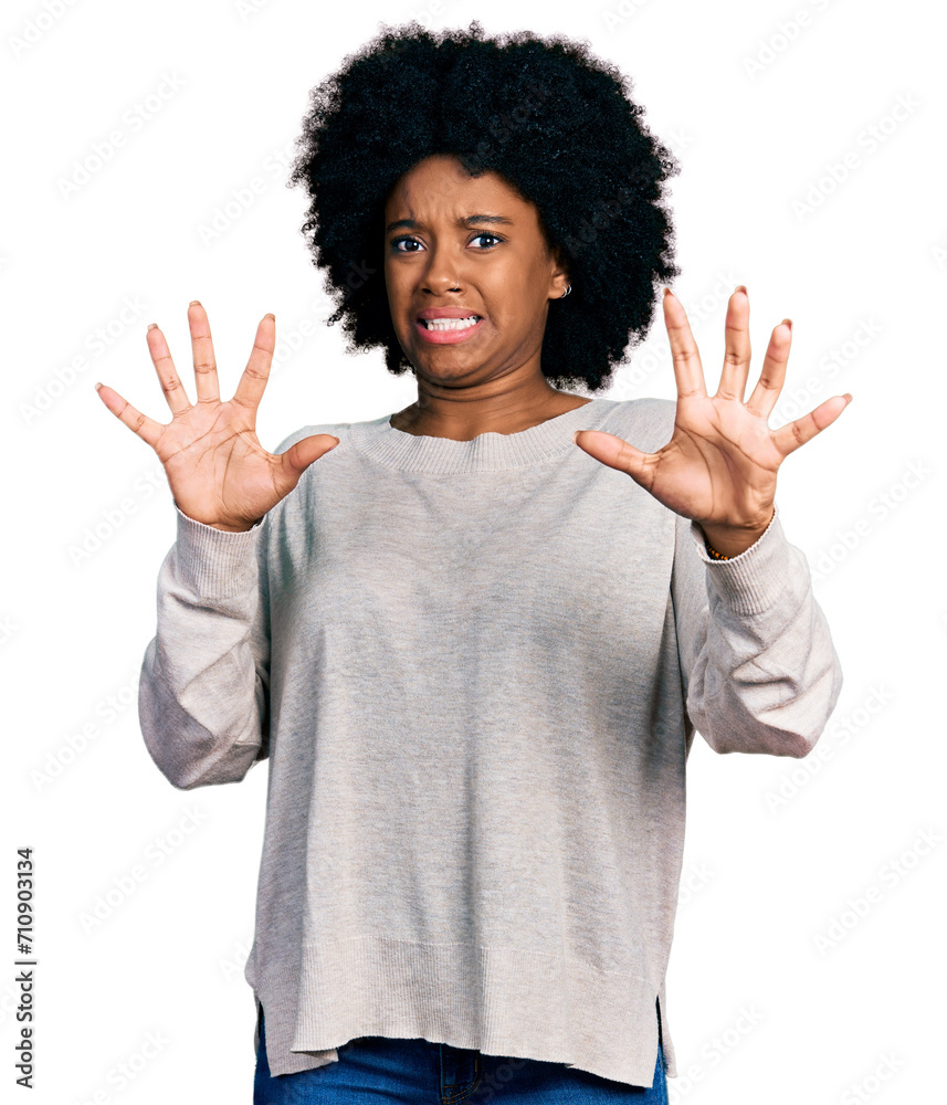 Young african american woman wearing casual clothes afraid and terrified with fear expression stop gesture with hands, shouting in shock. panic concept. Young african american woman wearing casual clothes afraid and terrified with fear expression stop gesture with hands, shouting in shock. panic concept.