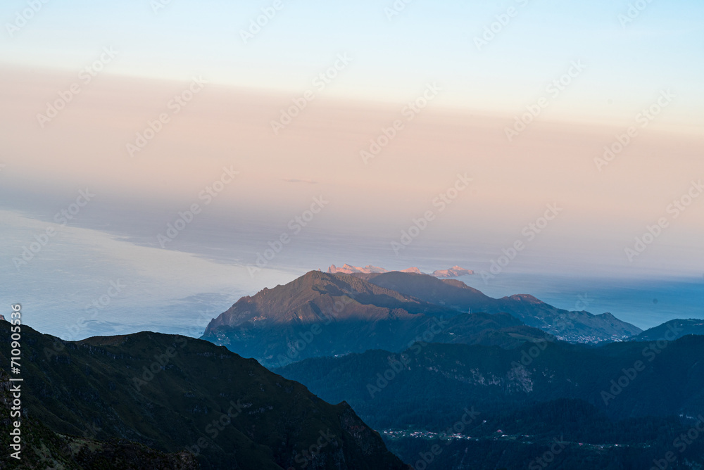 View to northeastern coast of Madeira from Pico Ruivo hill summit during sunset