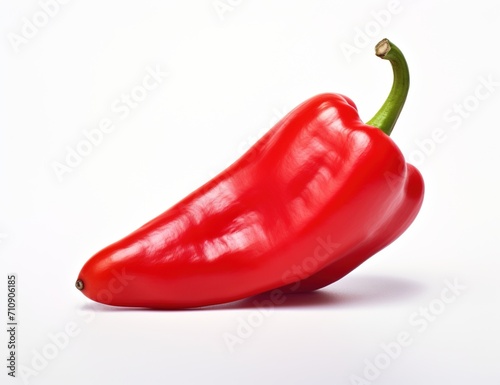 Single red bell pepper on white background