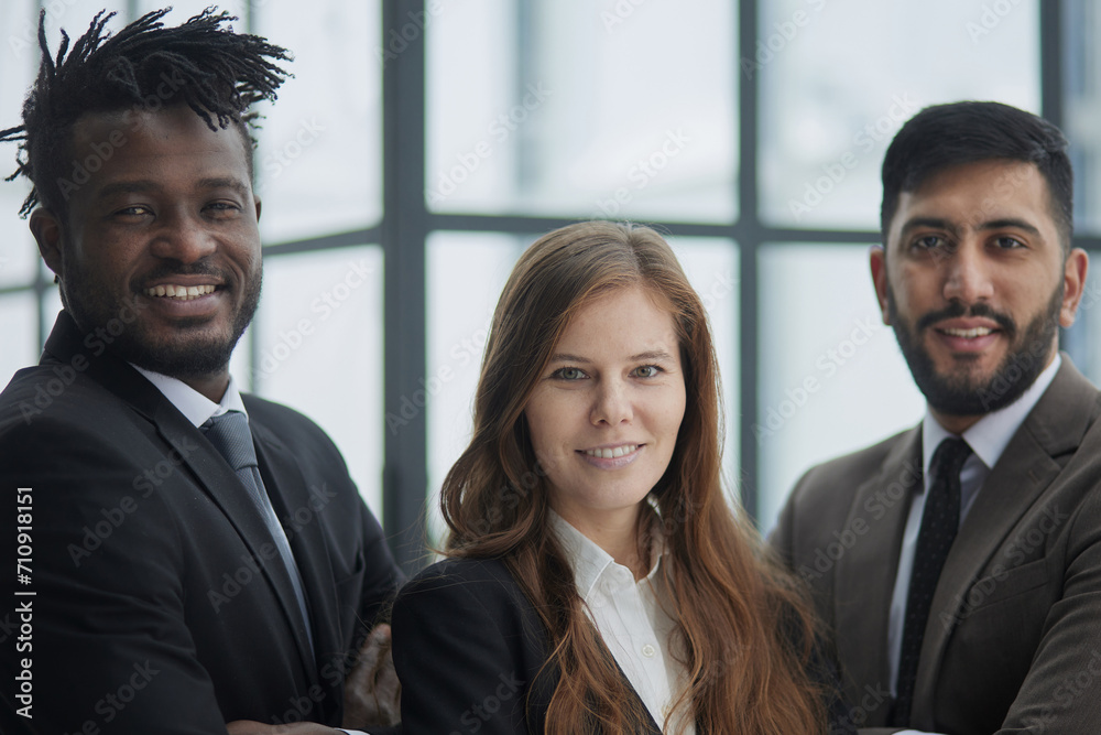 a group of three employees posing together with their arms crossed a group of three employees posing together with their arms crossed