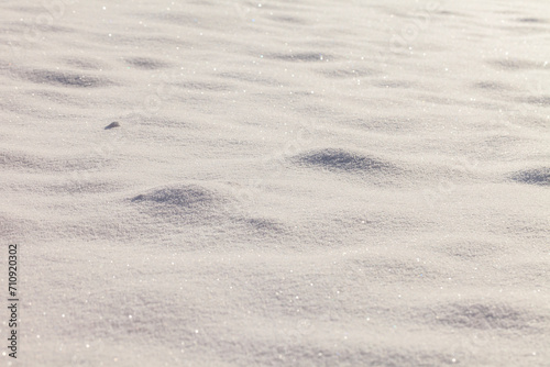 Sunny snow field texture background.