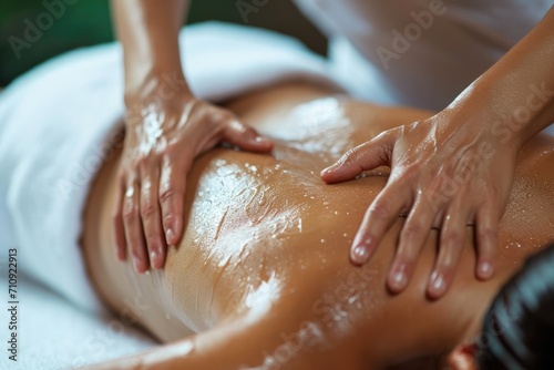 Massage Therapist Massaging an Woman s Back 